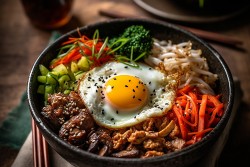 Food bowl with veggies and an egg in the center
